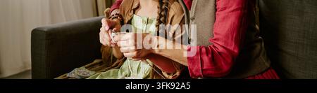 Senior Woman Teaching Girl Hand Knitting Craft at Home Stock Photo