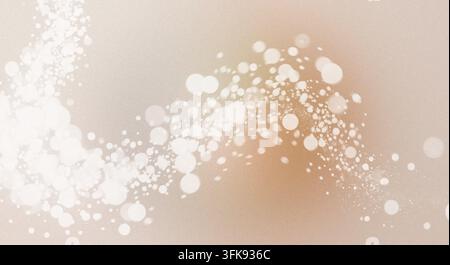 Abstract design with golden gradient, textured background, and flowing waves of glowing white bokeh light particles. Stock Photo