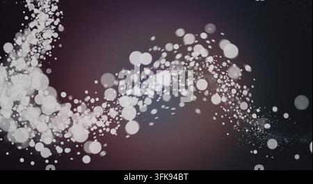 Abstract design with glowing white bokeh circles forming a wavy sparkling trail across a textured dark background. Stock Photo
