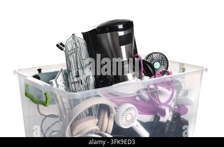 Plastic container with different broken household appliances for recycling isolated on white Stock Photo