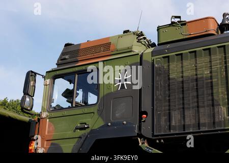 Military vehicle and truck with Iron Cross symbol belonging to the German Armed Forces. Germany, army and defense. Detail and close-up. Stock Photo
