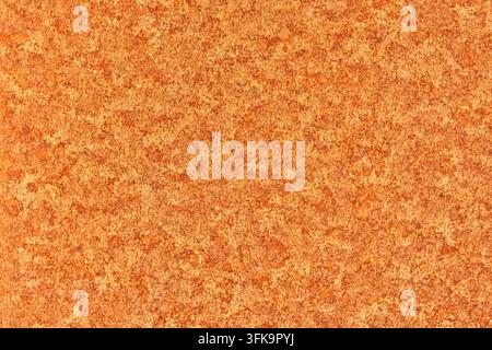 Close-up texture of rusty metal surface with mottled orange and brown patterns and grunge details Stock Photo