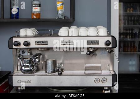 Professional commercial espresso coffee machine with coffee cups in a modern cafe interior. Front view of a professional commercial espresso coffee ma Stock Photo