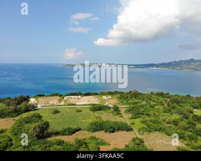 Aerial view of the lush landscape of Sesoko Island, featuring dense ...