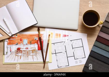 Interior design project creative workspace with architectural floor plans color swatches and hand-drawn kitchen sketch on a wooden desk Stock Photo