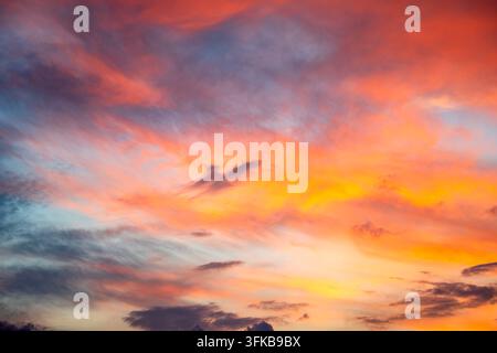 Vibrant orange and red sunset clouds in the sky Stock Photo
