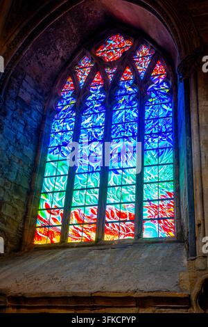 Blaze of light shining through cathedral window Stock Photo