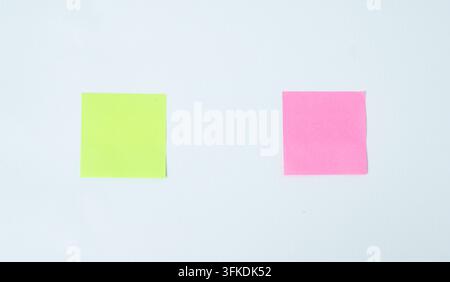 Two Colorful Sticky Notes For Idea Comparison, brainstorming, decision making, planning, and business communication concepts. Stock Photo