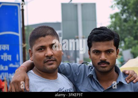 Portrait of two Indian men standing together outdoors. Stock Photo