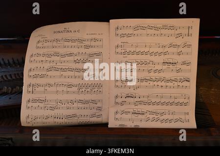 sheet music for a sonatina in C major resting on a piano Stock Photo