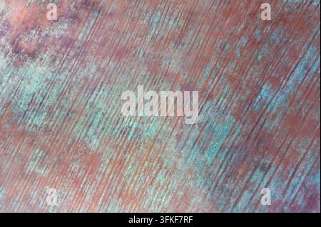 Metal surface oxidizing with turquoise patina and diagonal scratches. Stock Photo