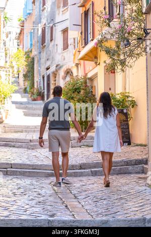 Young couple walking in the street of old town Stock Photo