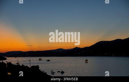 Dramatic Sunset with Crepuscular Rays Over Adriatic Sea in Croatia Stock Photo