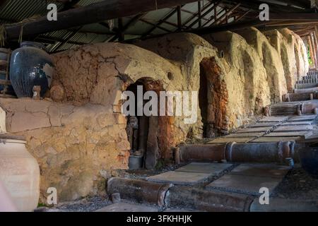 Japanese potter's earthen kiln called noborigama (登り窯), climbing kiln or stepped kiln or sloped kiln, in Shigaraki pottery town, Shiga, Japan. Stock Photo