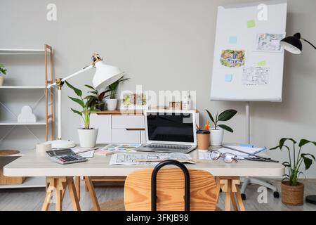 Architecture and interior design workspace, professional architect desk with laptop and blueprints for home planning and construction project developm Stock Photo