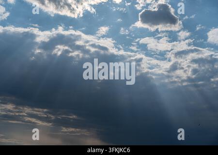 Jesus light shining through clouds in the sky Stock Photo