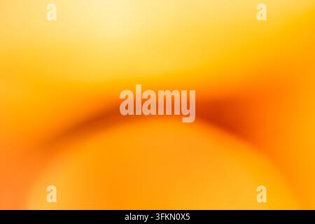 Abstract bokeh background with curved shapes and a blurred gradient of golden orange Stock Photo