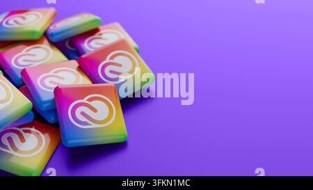 Close-up of the Adobe Creative Cloud subscription service logo on a pile on purple background with copy space as web banner header Stock Photo