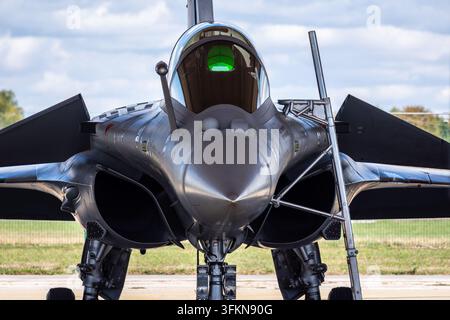 Close-up front view of a French Air Force Dassault Rafale B fighter jet parked under a shelter on the tarmac of Air Base 113 in Saint-Dizier, France. Stock Photo