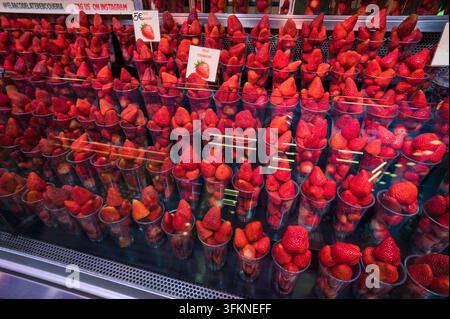 Fresh Strawberries in Plastic Cups For Sale at the Street Market Stock Photo