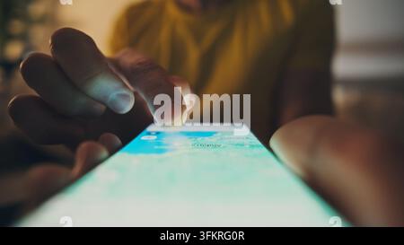 Poznan, Poland - 17 February 2026: Man Browsing Digital Map With Hand In Google Maps App On Smartphone Screen Stock Photo