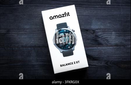Poznan, Poland - 11 April 2026: Amazfit Balance 2XT Smart Watch Box on Dark Wood Stock Photo