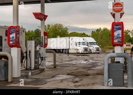 Rochester, NY-September 20, 2026: Gas station with several vehicles filling up with diesel fuel and gasoline. Stock Photo