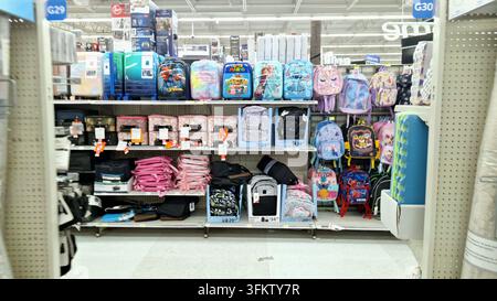 Toronto, ON, Canada - September 25, 2026: A retail store display featuring a wide variety of colorful school backpacks and luggage. Stock Photo