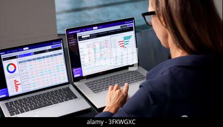 Compliance Manager Carefully Analyzes AI Risk Management Dashboard On Laptop. Stock Photo