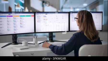 Human Resources Manager Uses Digital Software To Review Candidate Profiles Carefully. Stock Photo