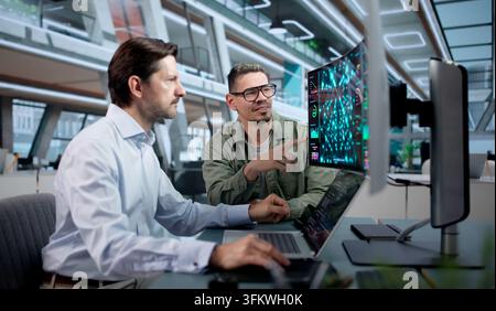 Data Scientist Uses Laptop And AI Tools To Build Predictive Models Collaboratively. Stock Photo