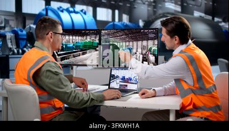 Engineer Uses SCADA Software To Monitor Real-time Plant Power Systems. Stock Photo