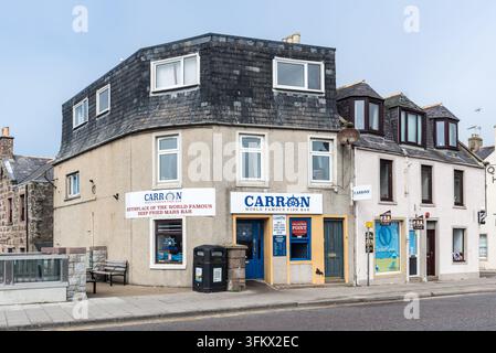 Stonehaven, Scotland, UK – August 17, 2025: Carron Fish Bar on Allardice Street, famed as the birthplace of the deep-fried Mars bar, attracts visitors Stock Photo