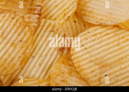 Lots of potato chips, texture close up Stock Photo
