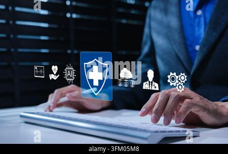 AI driven healthcare and medical technology concept. Person typing on keyboard with medical cross shield icon, representing healthcare protection, AI Stock Photo