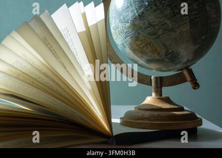 Silhouette of a vintage globe on a blue background Copy space Stock Photo