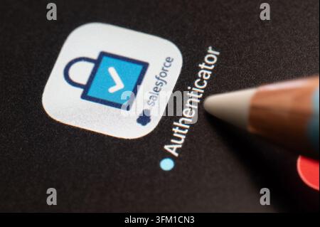 New York, USA - september 4, 2026: Press touch on Salesforce authenticator mobile application in pixel black background screen macro close up view Stock Photo
