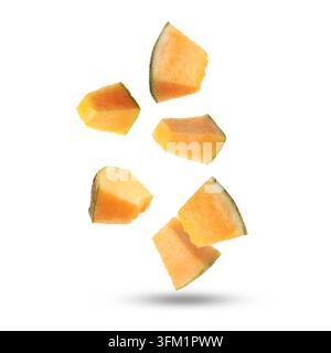 Pieces of cantaloupe melon falling on white background Stock Photo