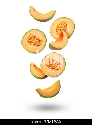 Pieces of cantaloupe melon falling on white background Stock Photo