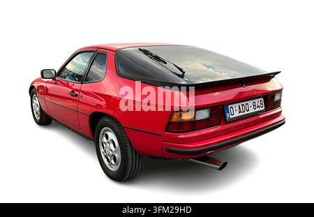 Red Porsche 924, a classic German sports car, isolated on a white background Stock Photo