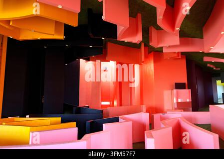 January 04, 2022, Yoro, Japan: Colorful interior of a contemporary art installation featuring maze-like walls and suspended geometric structures in vi Stock Photo