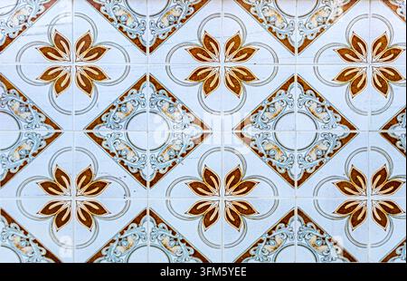 Close-up of traditional decorative ceramic tiles featuring a repeating geometric and floral pattern in Setenil de las Bodegas, Andalusia, Spain Stock Photo