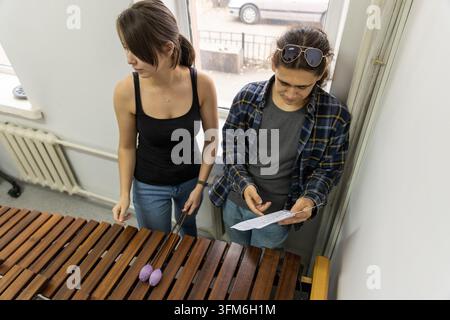 Top view of musicians with sheet music Stock Photo