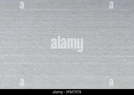 Close-up footage of white expanded polystyrene foam with visible fused beads, porous cellular structure and lightweight insulation texture for constru Stock Photo