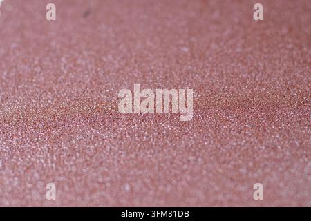Detailed close-up footage of coarse sandpaper showing dense abrasive grit, rough grain an uneven textured surface suitable for industrial, workshops Stock Photo