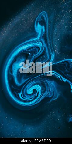 Ink spill. Sparkling fluid. Defocused blue color glitter mix acrylic bright texture floating on abstract marble art background. Stock Photo