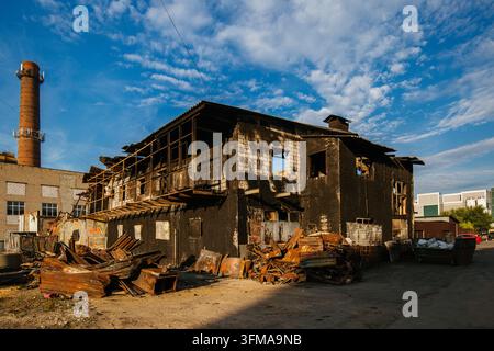 Aftermath of fire. Burnt industrial building after fire or attack. Stock Photo
