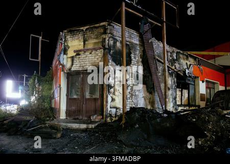 Aftermath of fire. Burnt industrial building after fire or attack. Stock Photo