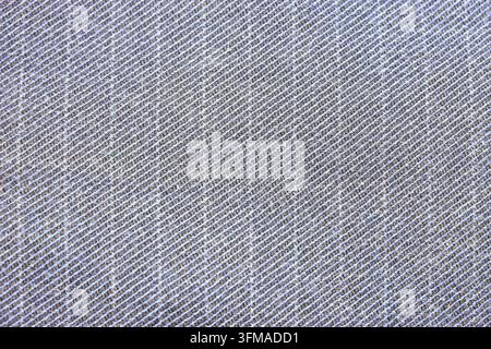 Blue gray twill fabric with diagonal woven texture in close-up. Denim textile for clothing and apparel design. Fashion material, garment making and se Stock Photo