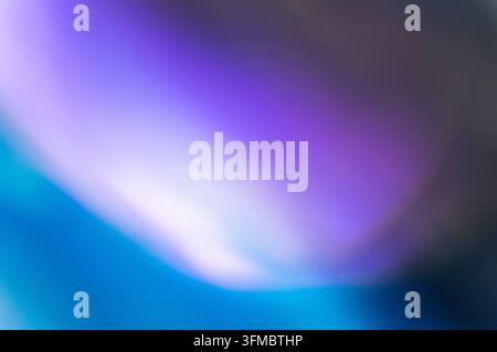 Soft ethereal gradient blur with subtle noise. Blends electric blue, white-purple, and muted grey-purple. Extreme soft focus creates bokeh, ample copy Stock Photo
